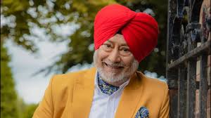 Jaswinder Bhalla smiling on film set, iconic Punjabi comedian and actor